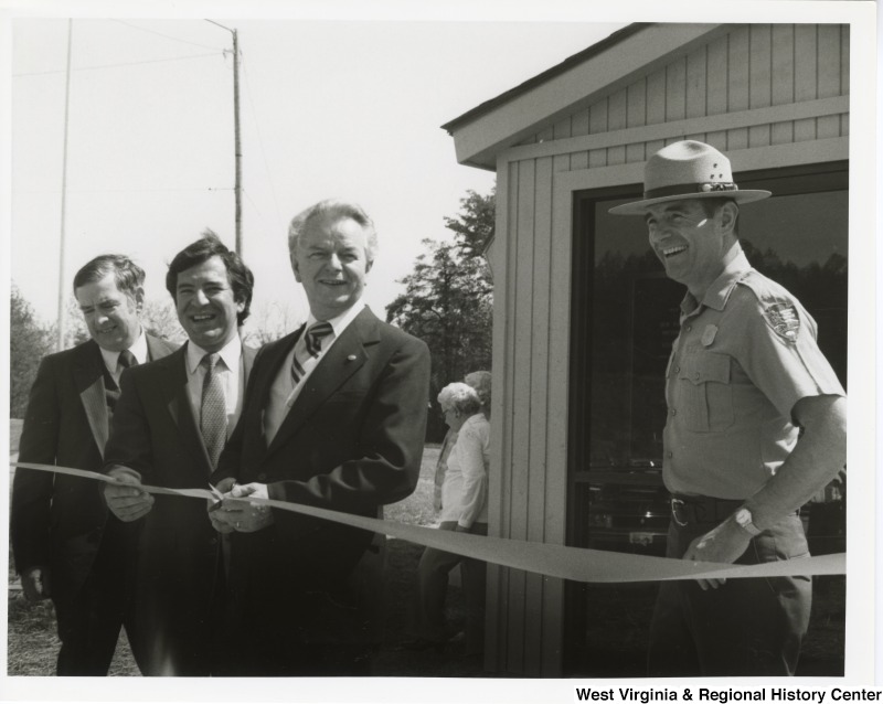 From left to right: James W. Coleman, Mid-Atlantic Regional Director, National Parks Service; Congressman Nick Rahall II; Senator Robert C. Byrd; and James W. Carrico, Superintendent, New River Gorge National River. Senator Byrd is cutting the ribbon for the opening of the New River Gorge Canyon Rim Visitor Center.